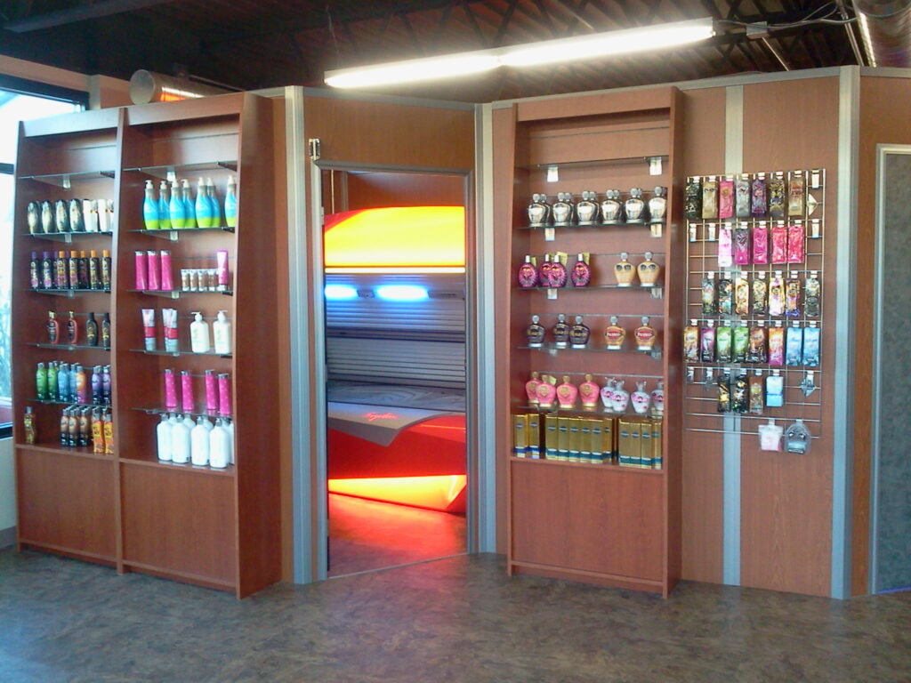 built-in cherry paneled shelving for tanning products
